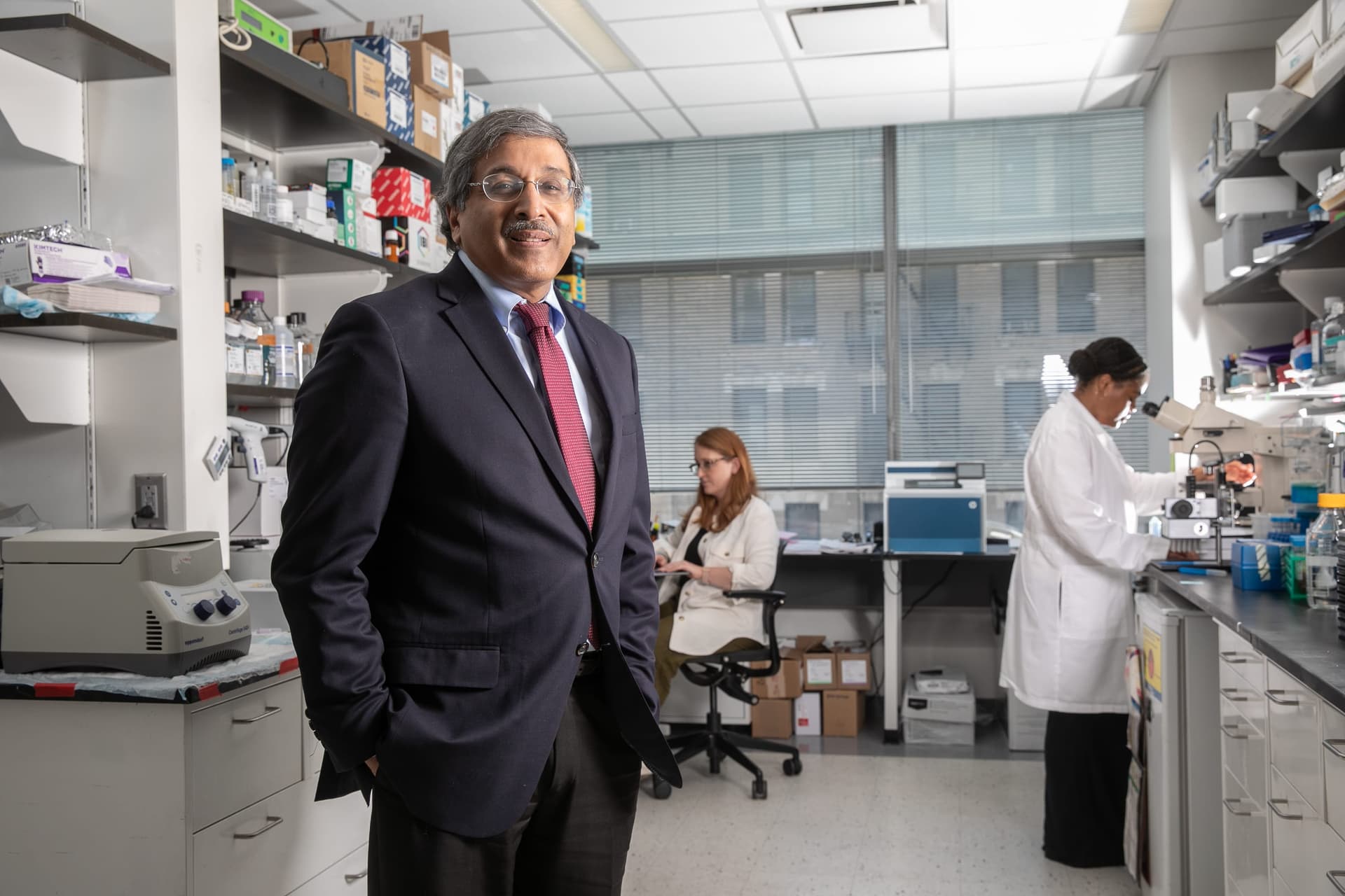 A man standing in a lab next to a woman